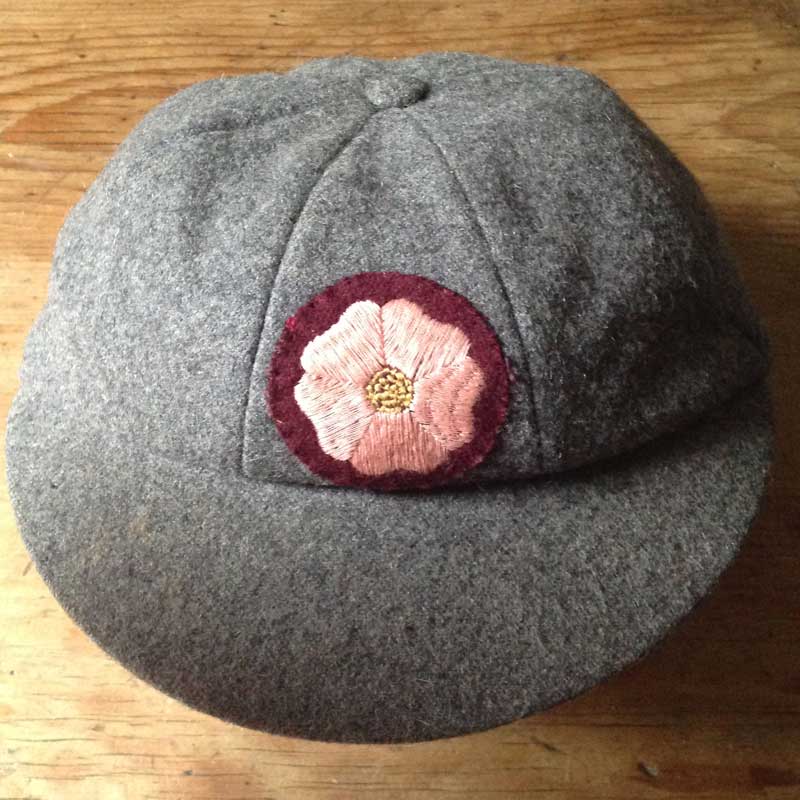 Roses Way Cap and badge